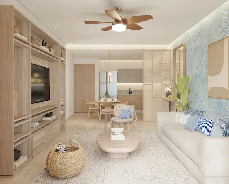 Sala de Village BLU con sofá blanco, muro de TV y detalles en azul