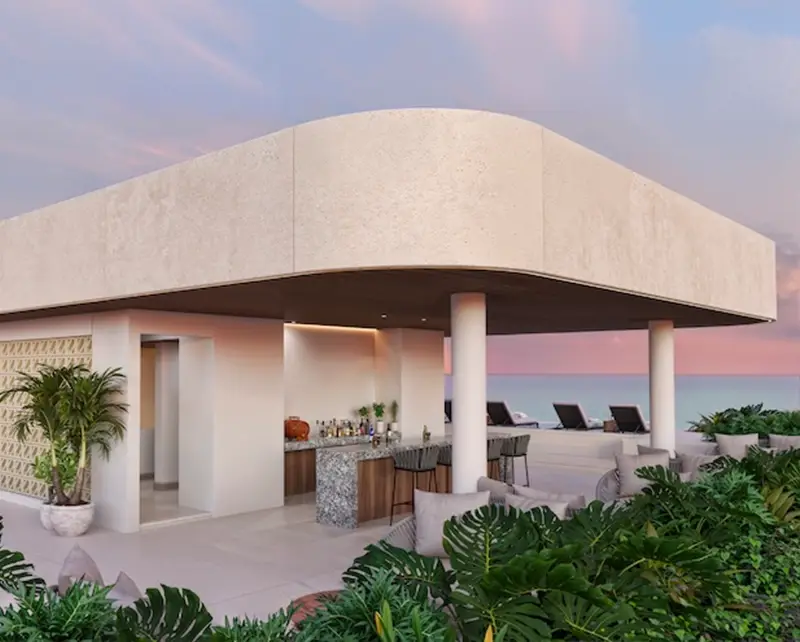 Rooftop bar de Village BLU con vista al mar Caribe al atardecer